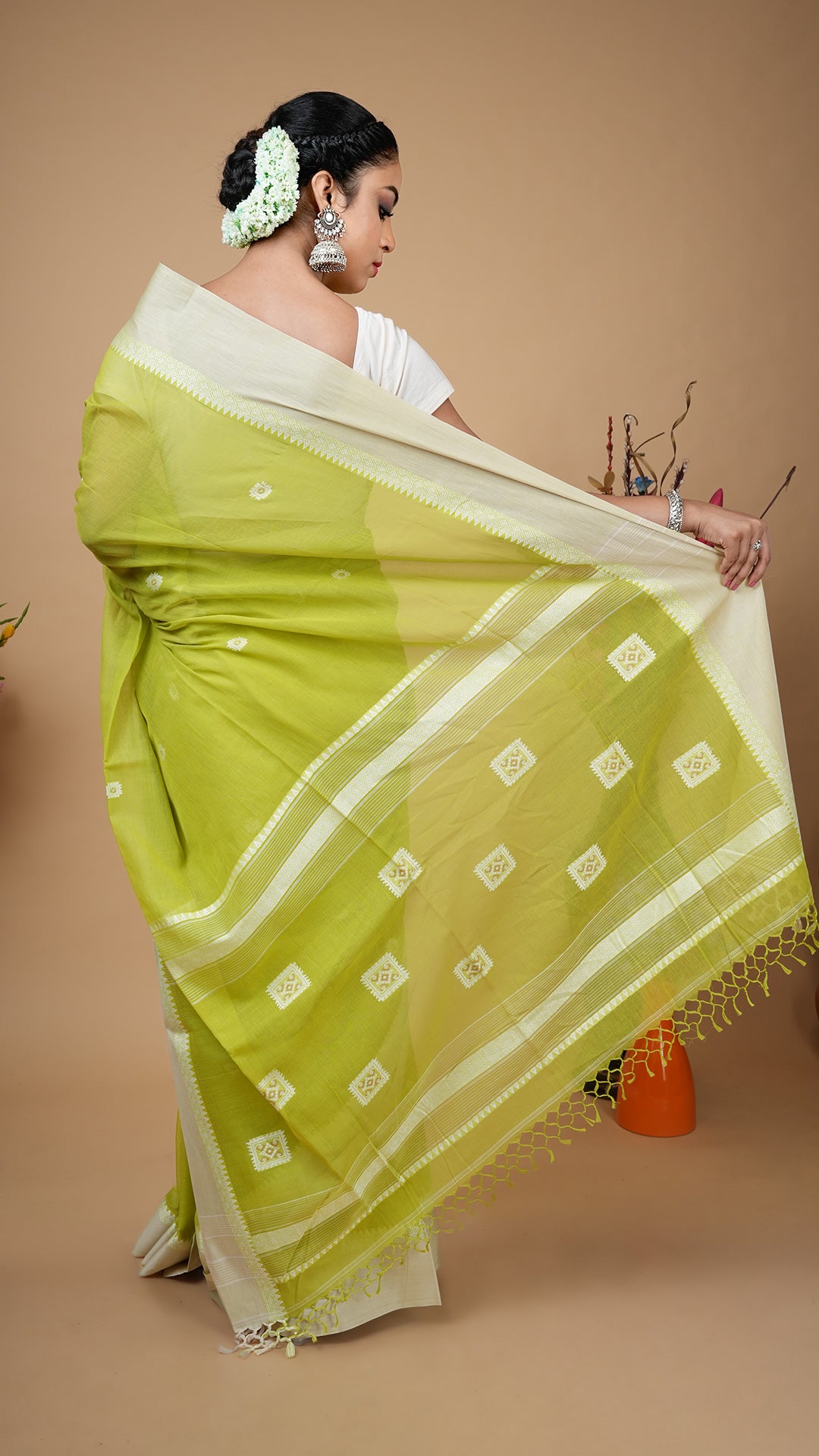 A bright green tangail saree