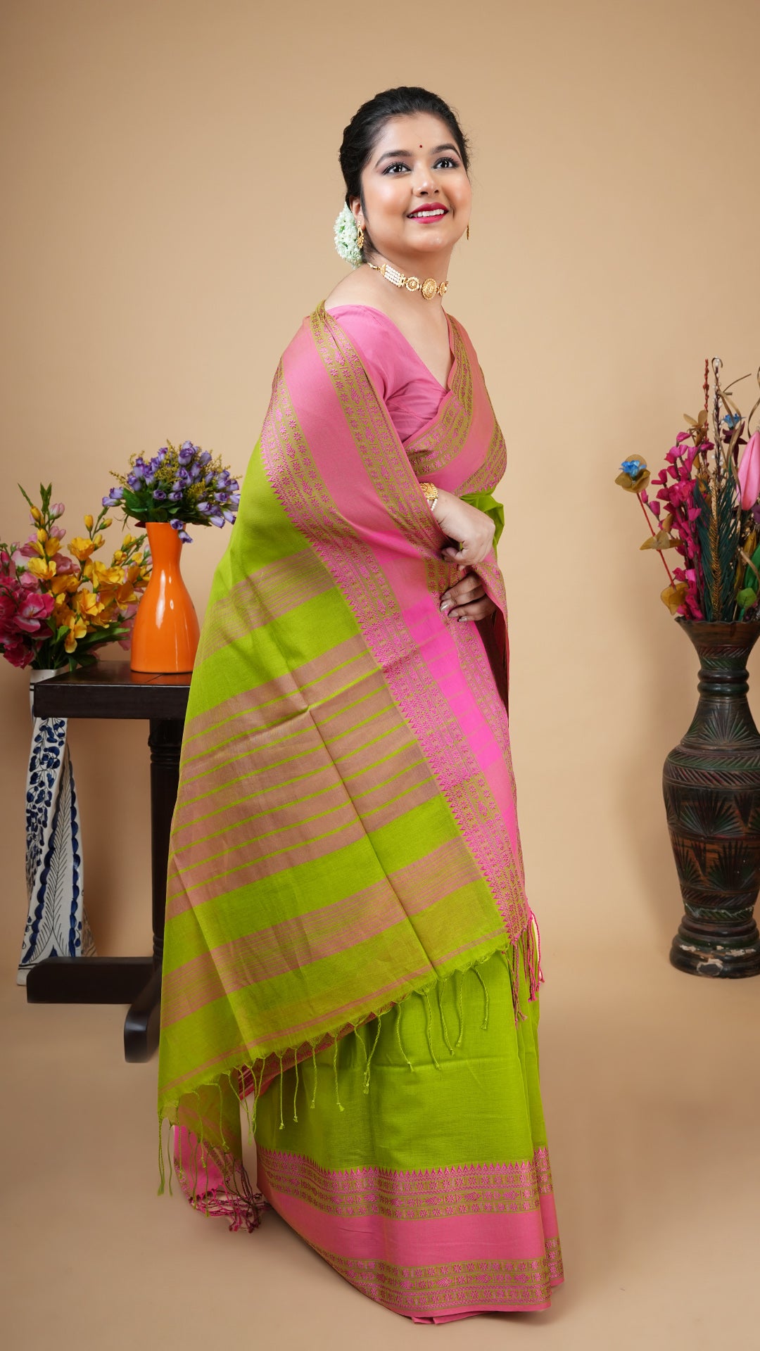 A dark green tangail saree