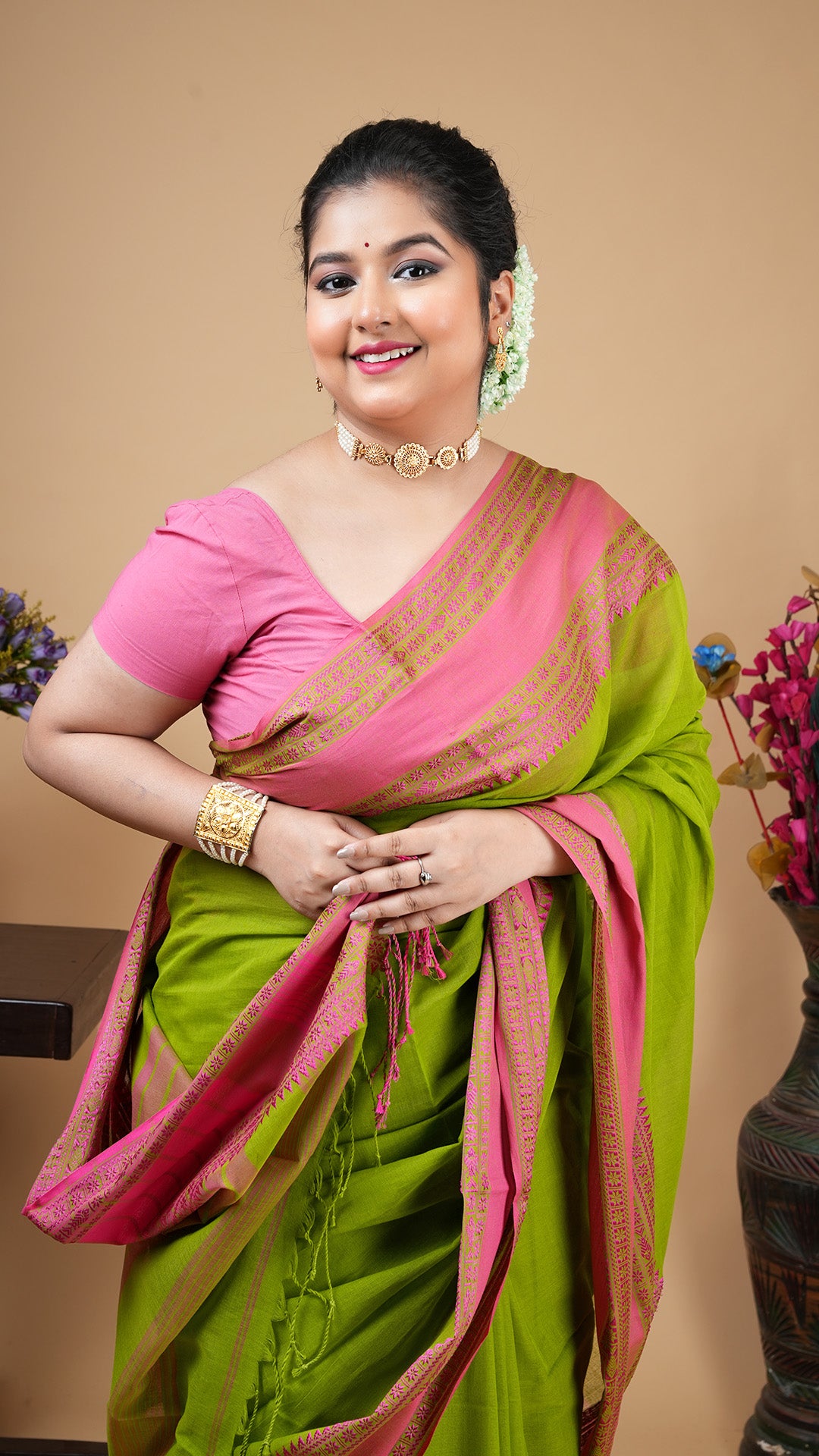 A dark green tangail saree