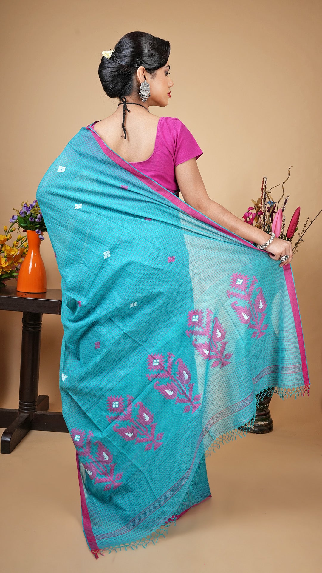 A sea green check saree