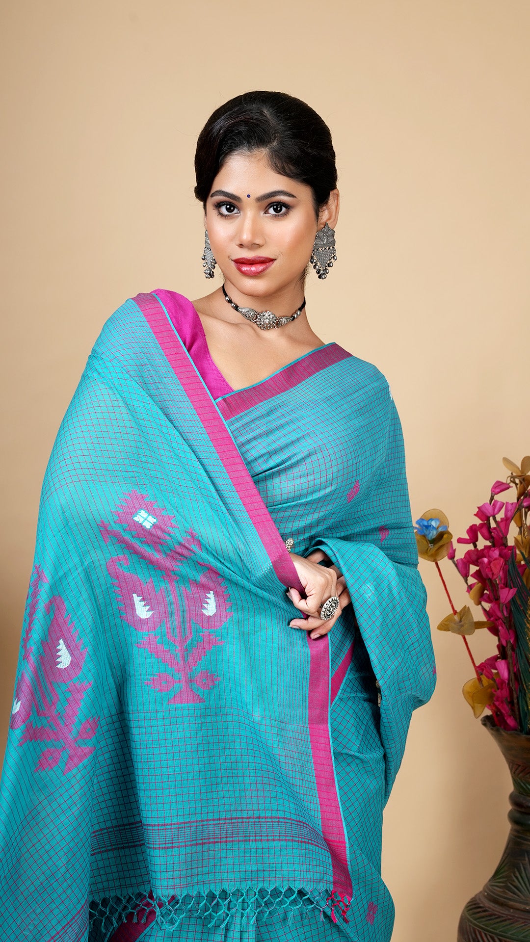 A sea green check saree