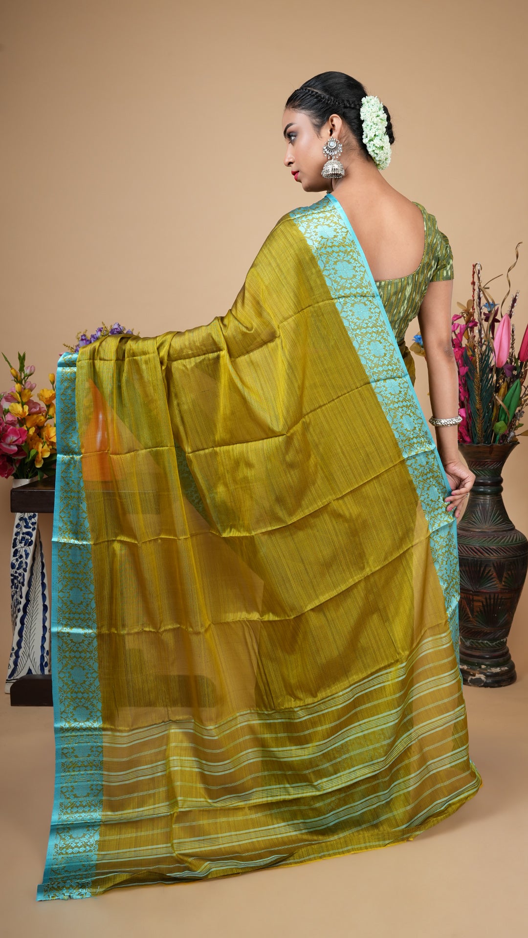 A dark olive silk saree