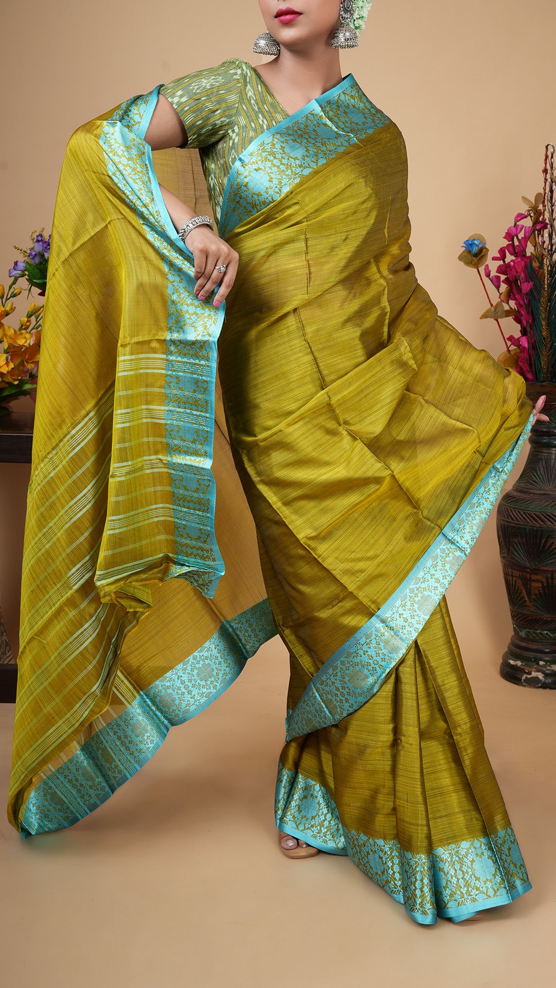 A dark olive silk saree