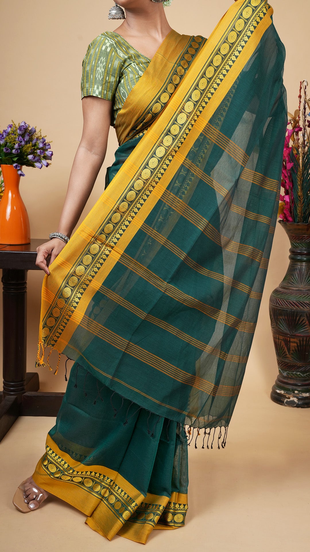 A deep green tangail saree