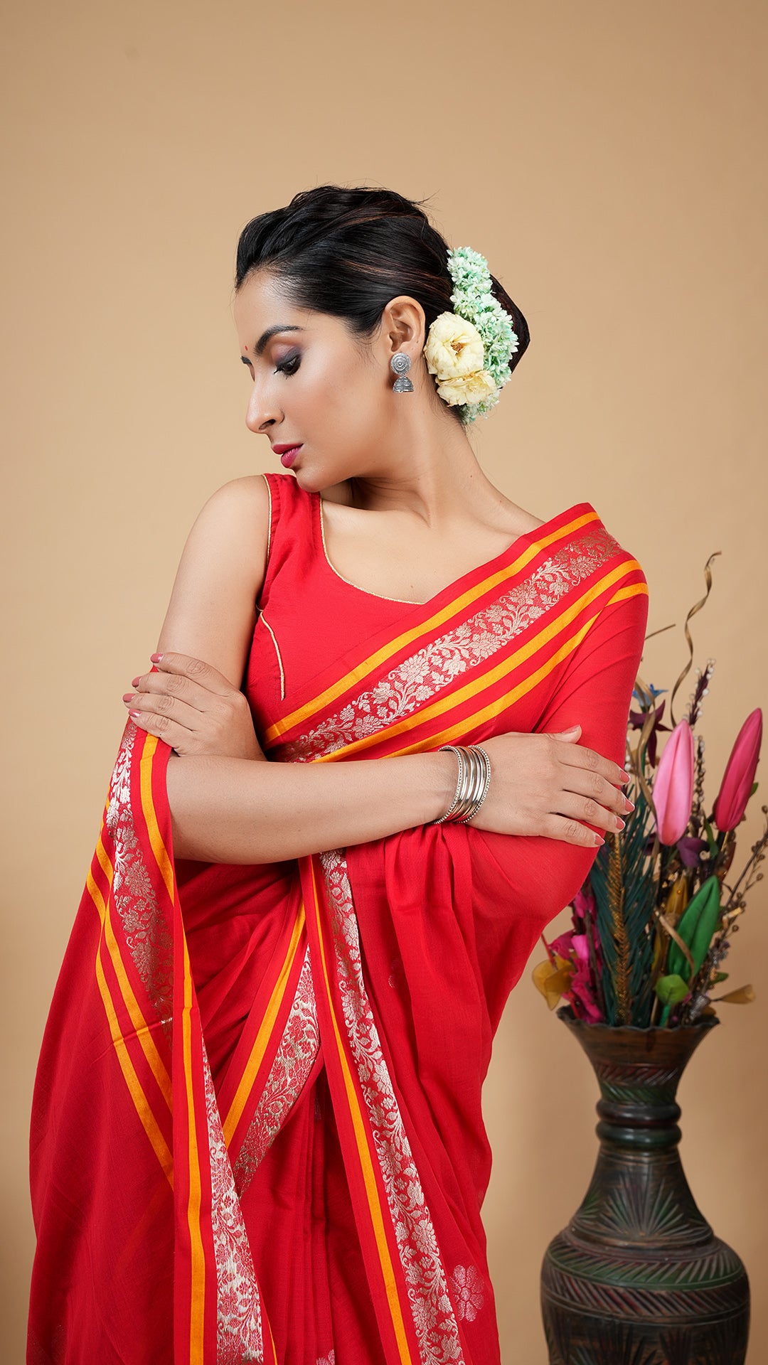 A red and gold saree