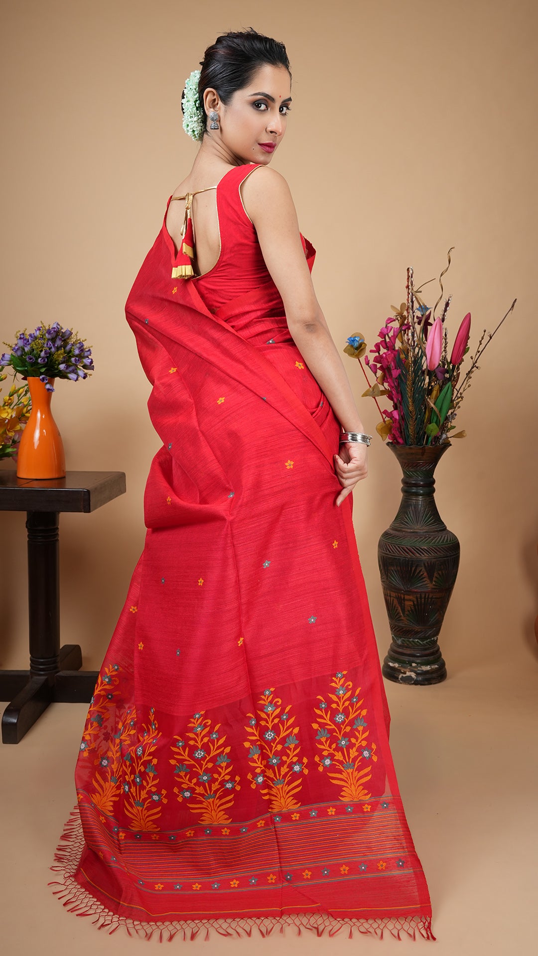 A red with multi colour raw silk saree