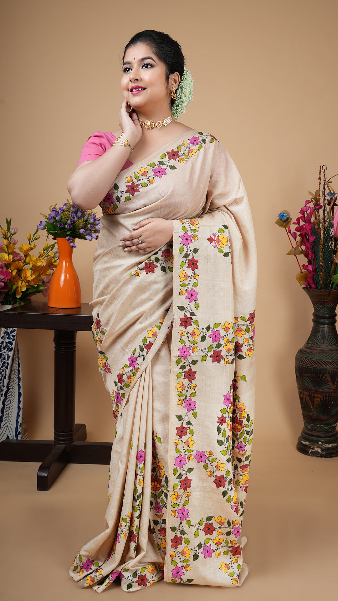 Natural tassar kantha saree with multicolour embroidery in green, pink, rust, yellow, mustard and black on border, body and pallu.