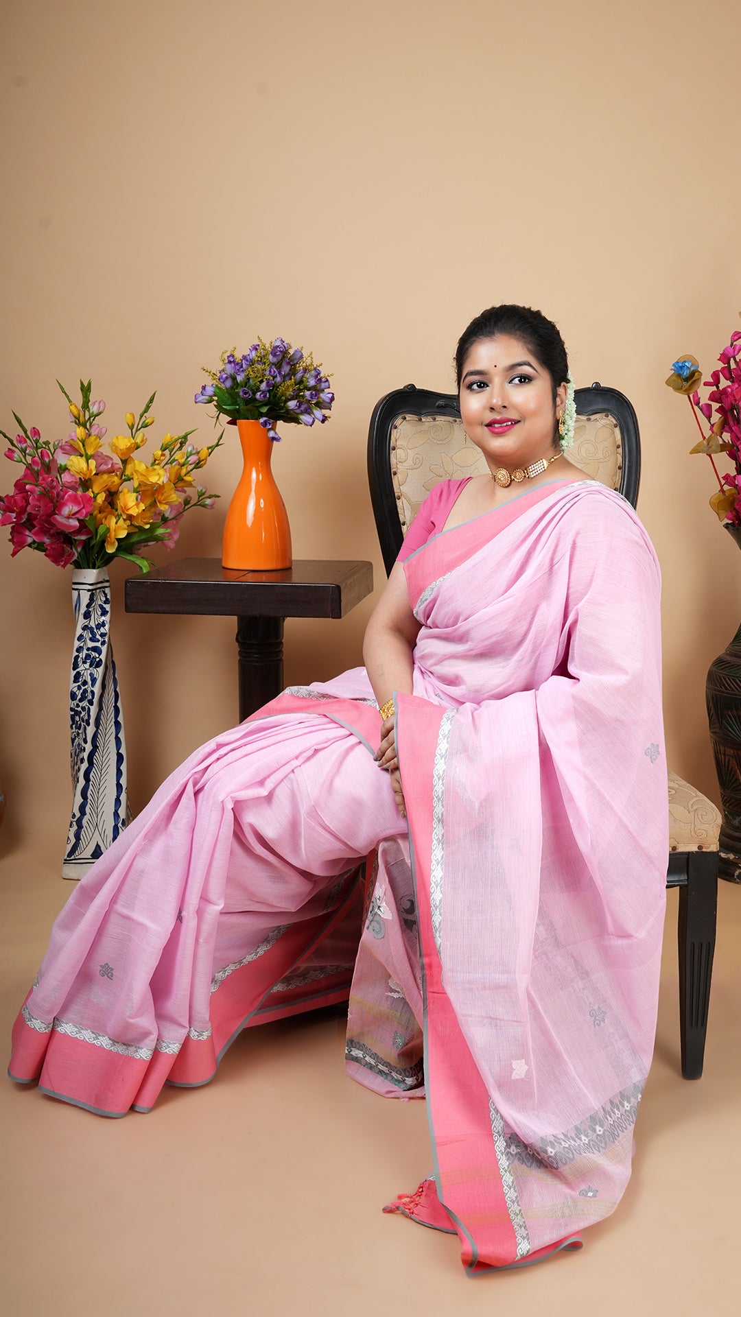 A light pink tangail saree