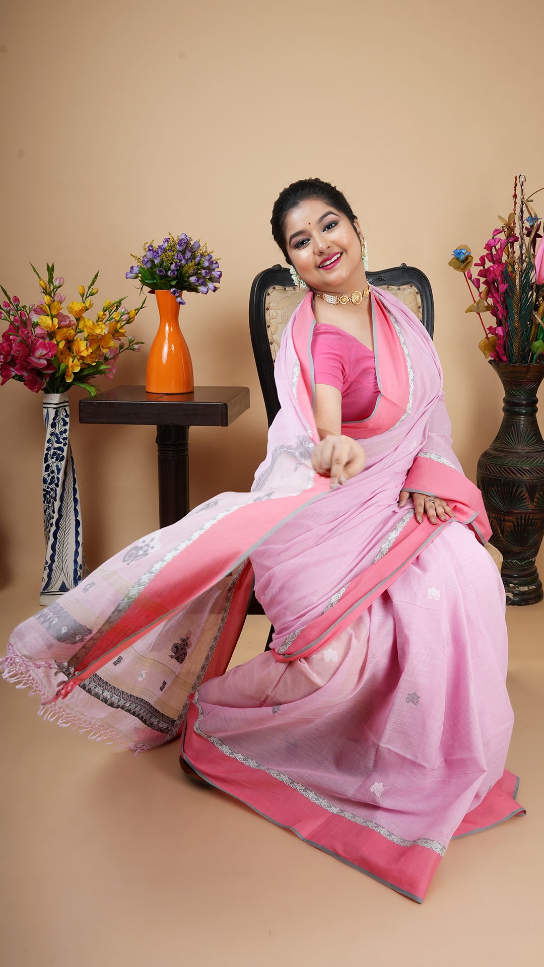 A light pink tangail saree