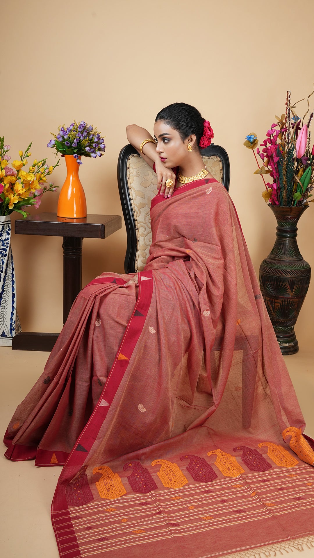 A light maroon tangail saree