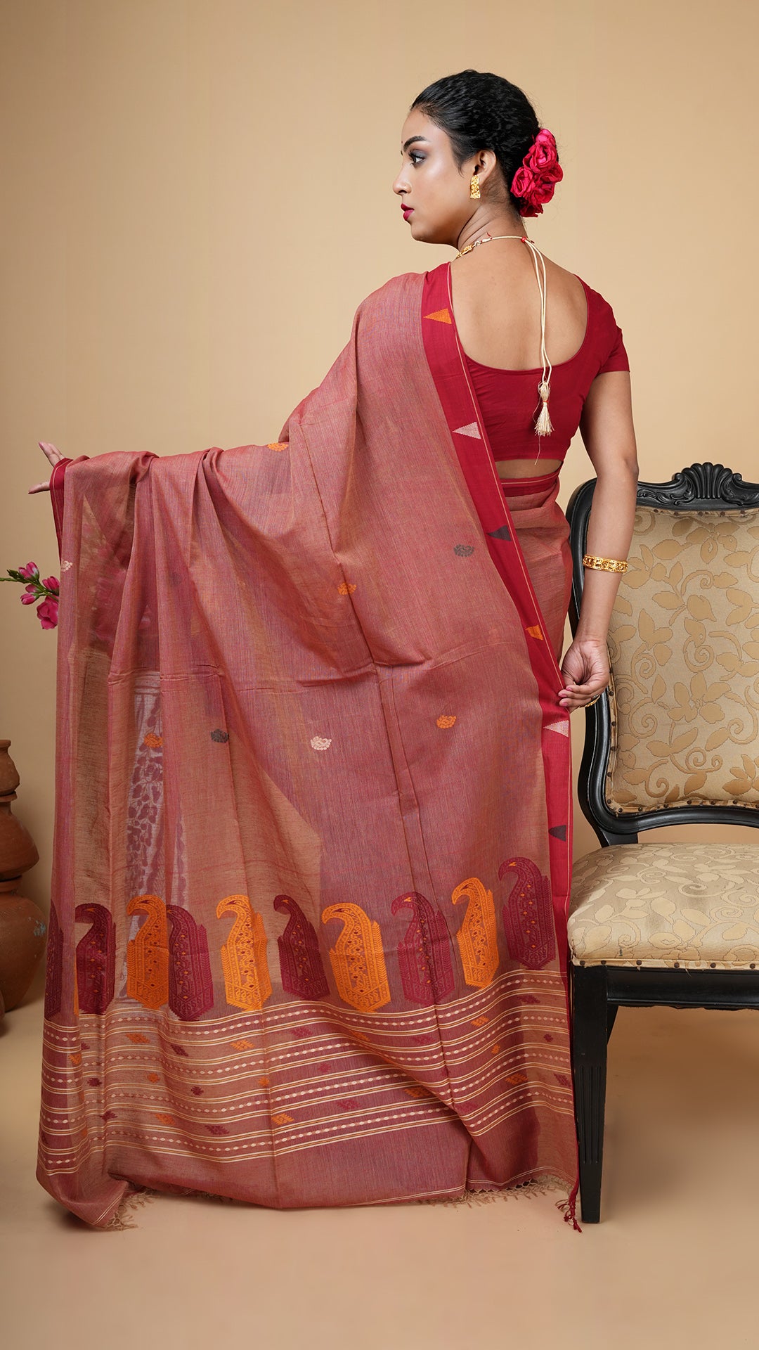 A light maroon tangail saree