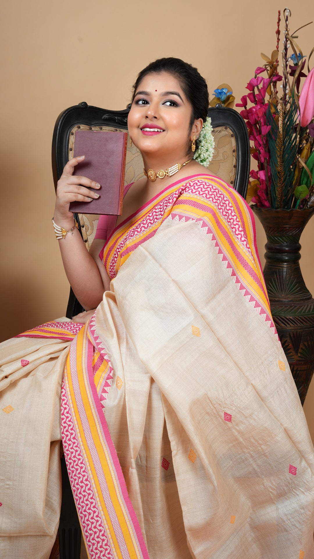 A tassar saree in pink and yellow weave