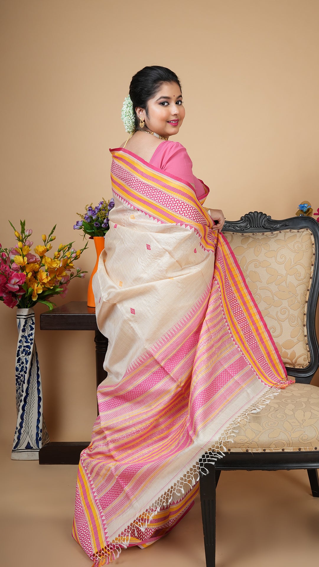 A tassar saree in pink and yellow weave
