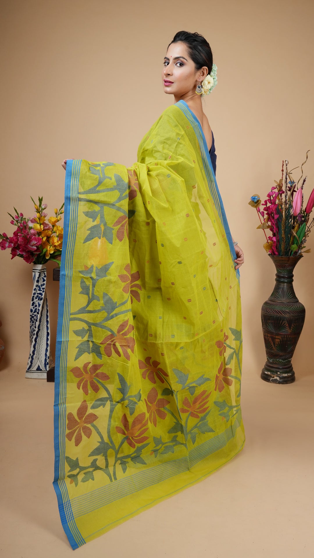A green coloured dhakai saree