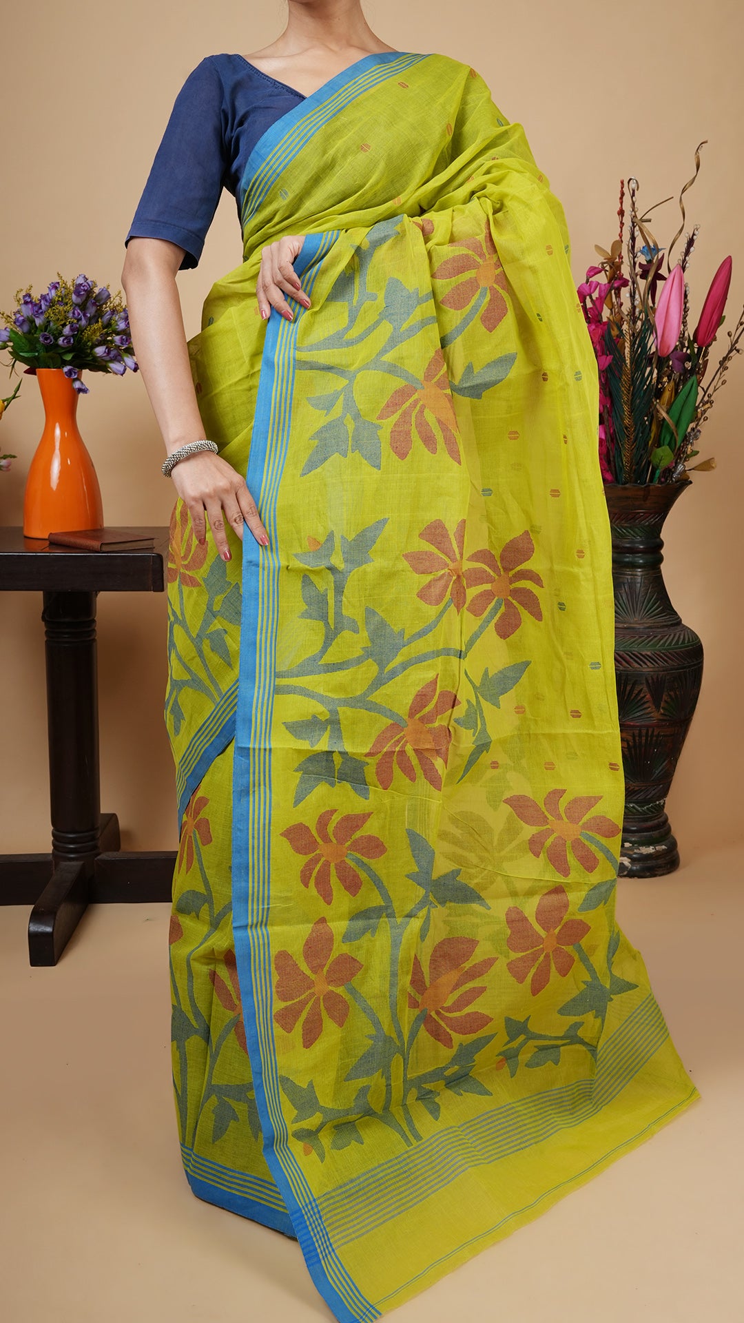 A green coloured dhakai saree