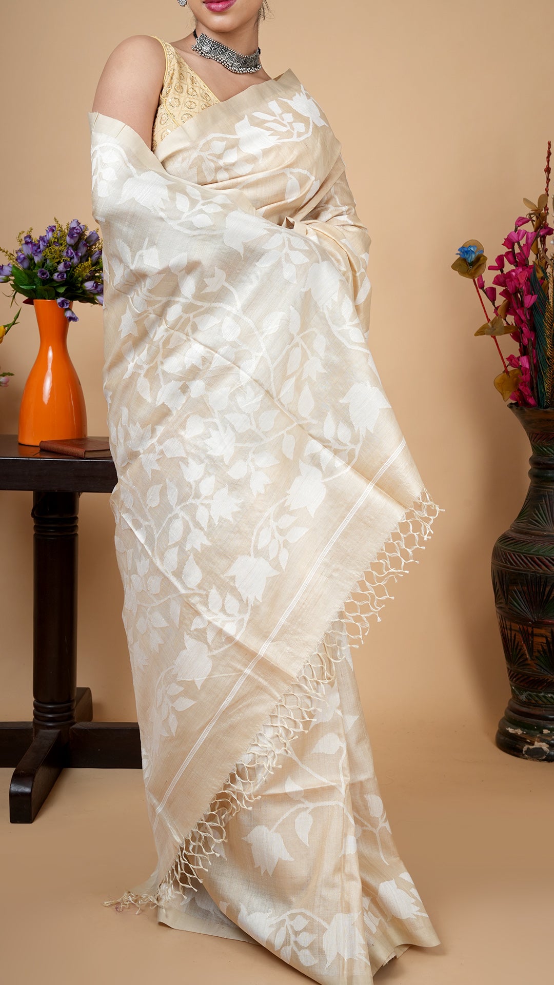 A tassar all over saree pallu detail in off white dhakai weave, fine floral weaving with soft tassels and luxurious finish