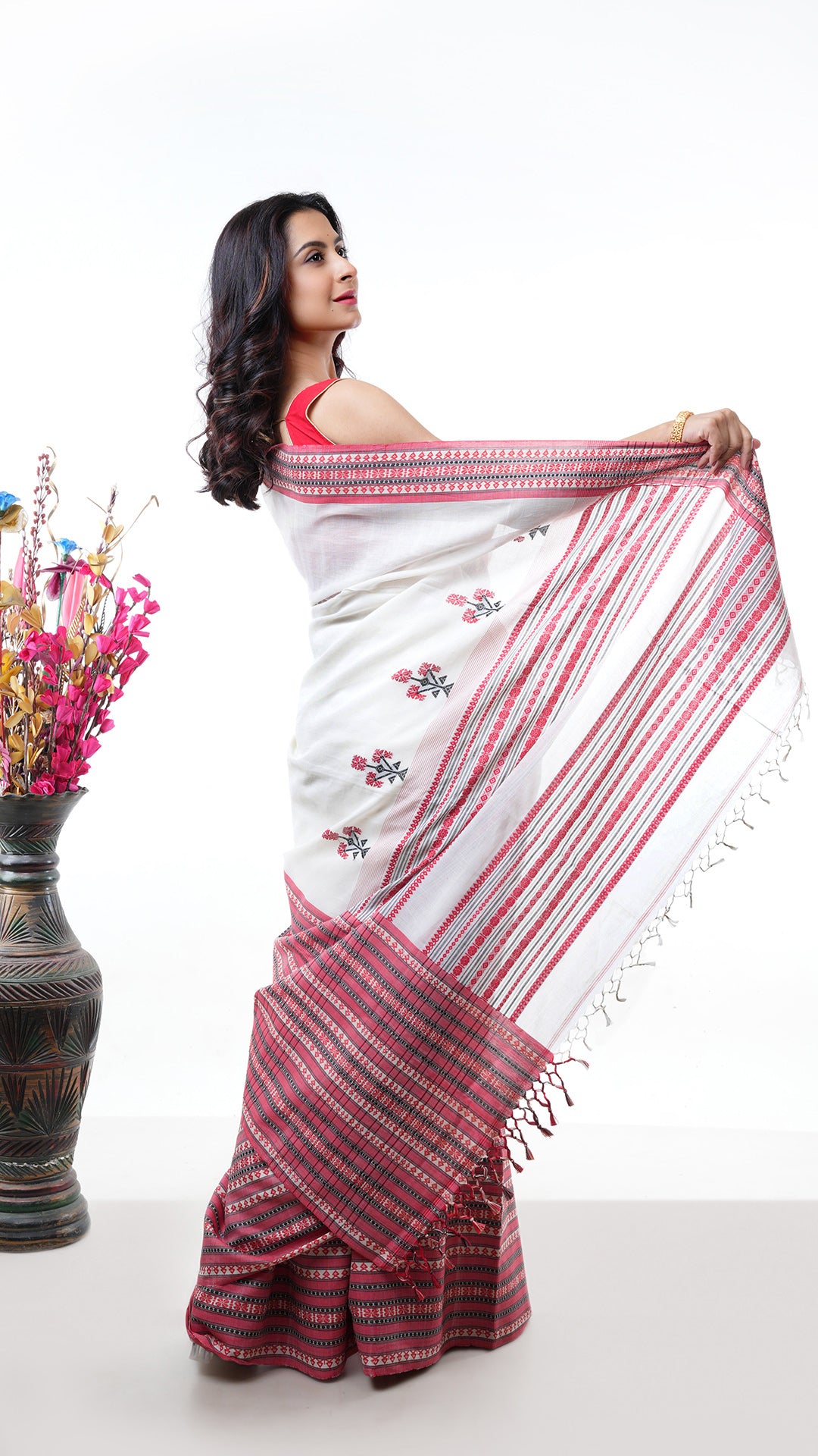An off white broad border saree