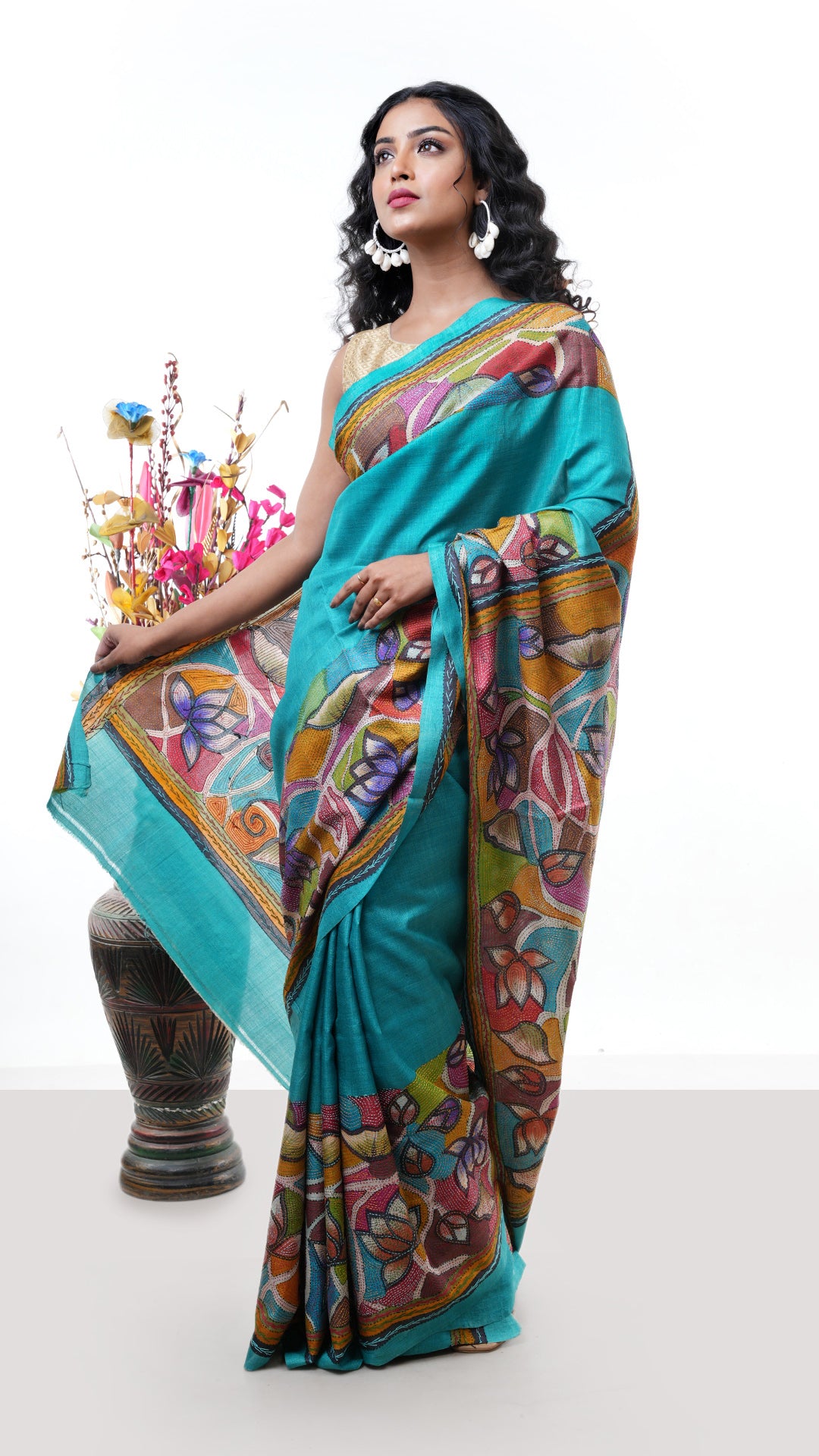 A tassar kantha saree in sea green colour. The pallu is rich with kantha thread work. Crafted with tassar Warp and weft. Standard 5.5-meter length. Includes matching blouse piece. Kantha, handloom silk sari.
