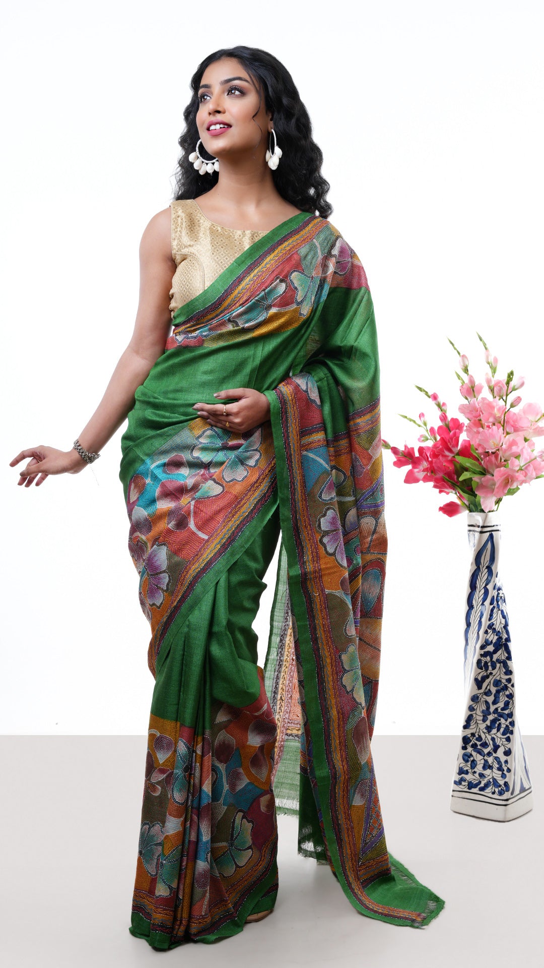 A green tassar kantha saree. A tassar kantha sari with intricate thread work. Crafted with tassar Warp and weft. Standard 5.5-meter length. Includes matching blouse piece. kantha, tassar, handloom silk sari