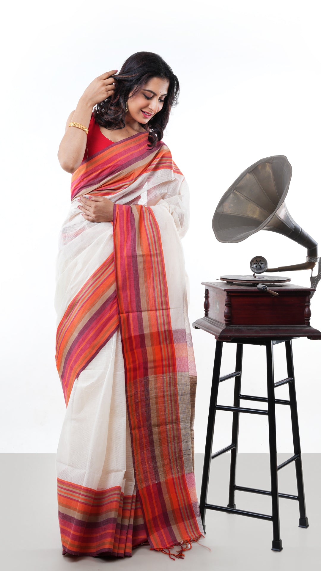 An off white Tangail saree. An off white sari with traditional weave. Crafted with soft cotton Warp and weft. Standard 5.5-meter length. No blouse piece included. Tangail saree, cotton saree