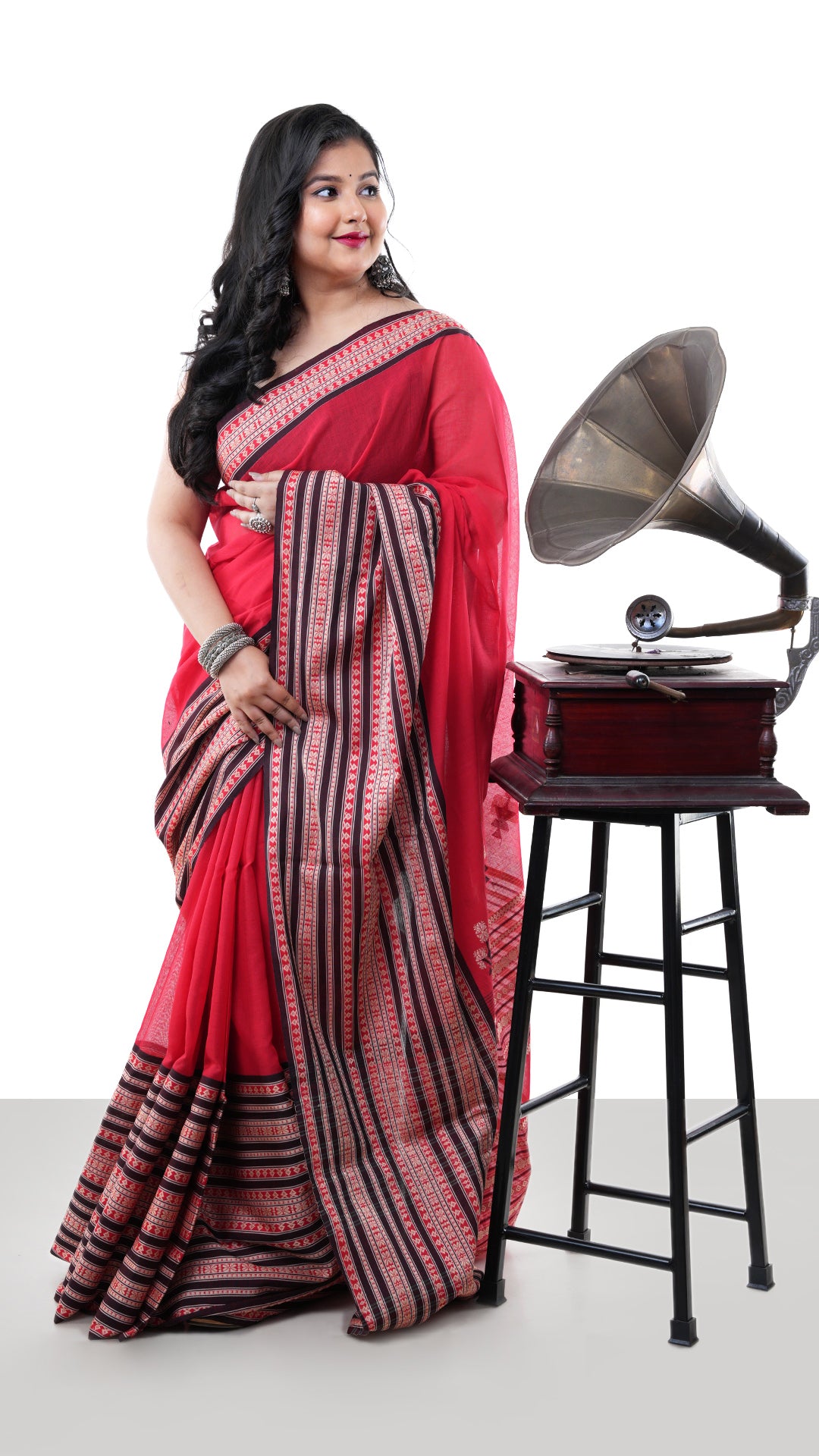A red Tangail saree in soft cotton. A red sari with white weave. Crafted with soft cotton Warp and weft. Standard 5.5-meter length. No blouse piece included. Tangail saree, cotton saree