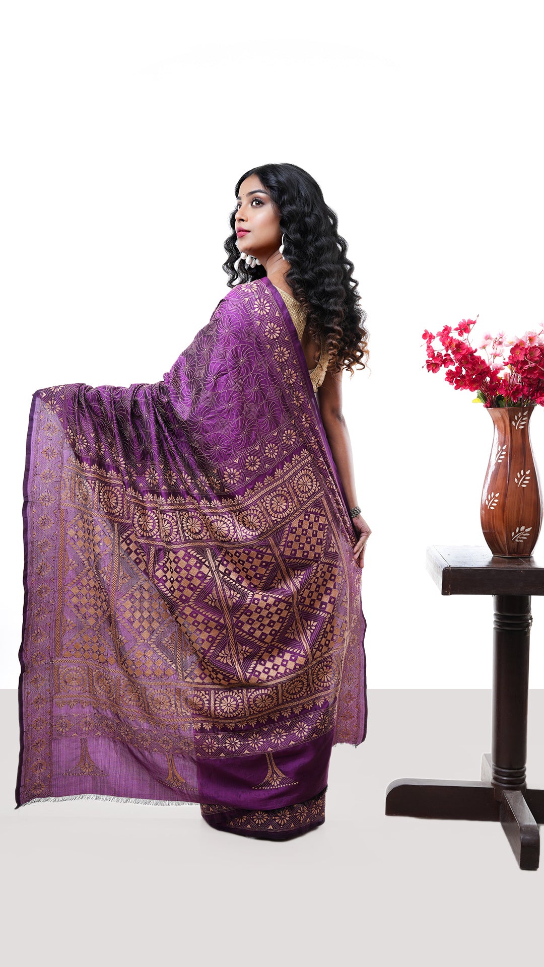 A magenta silk kantha saree