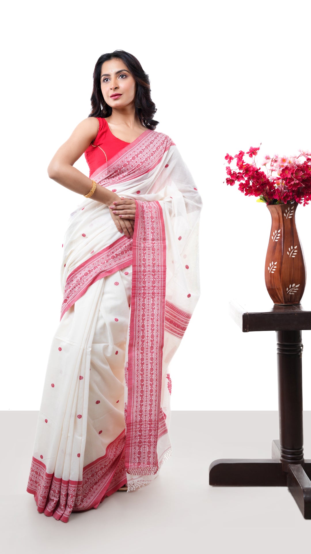 An off white red cotton saree