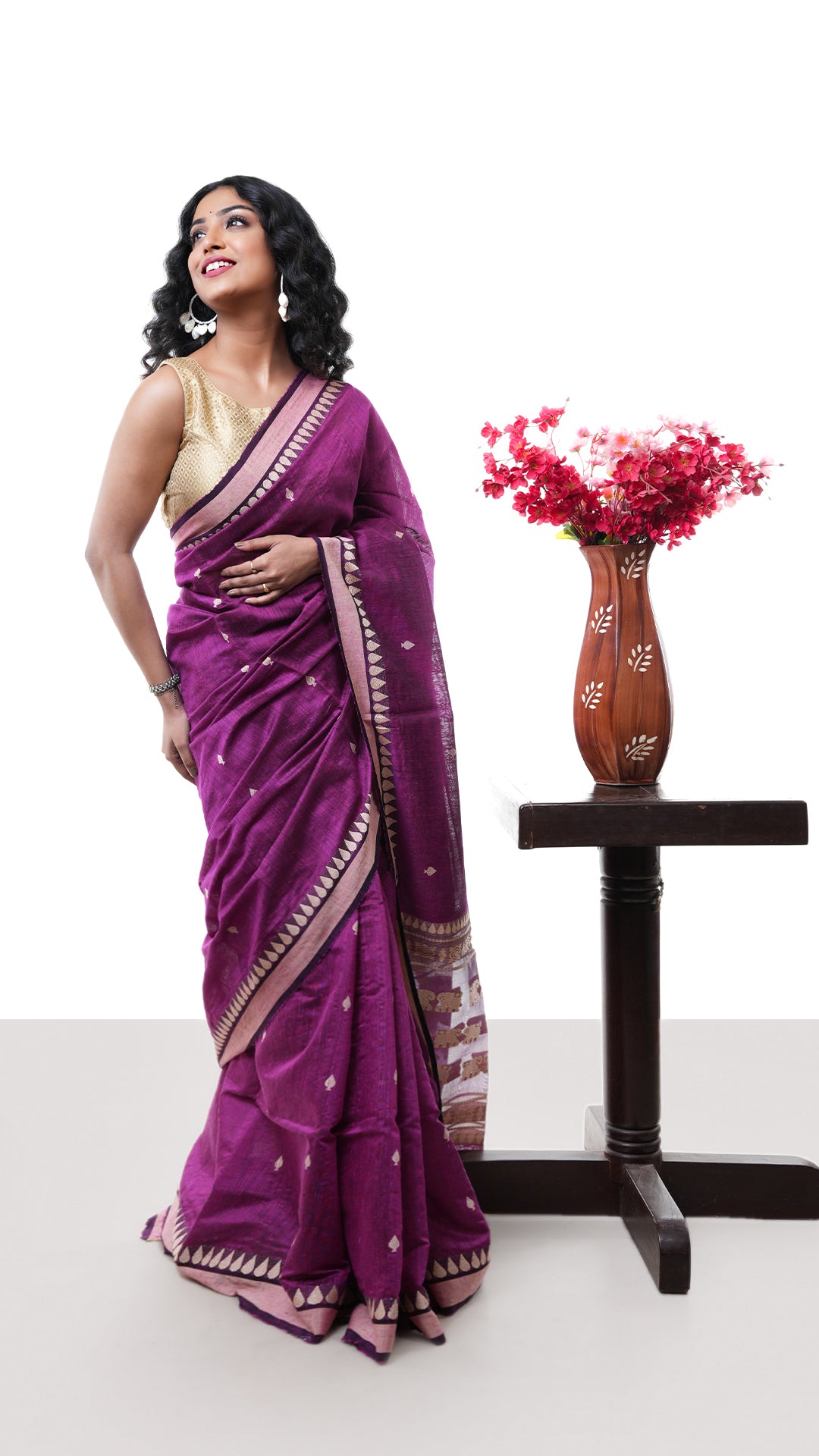 A purple raw silk saree