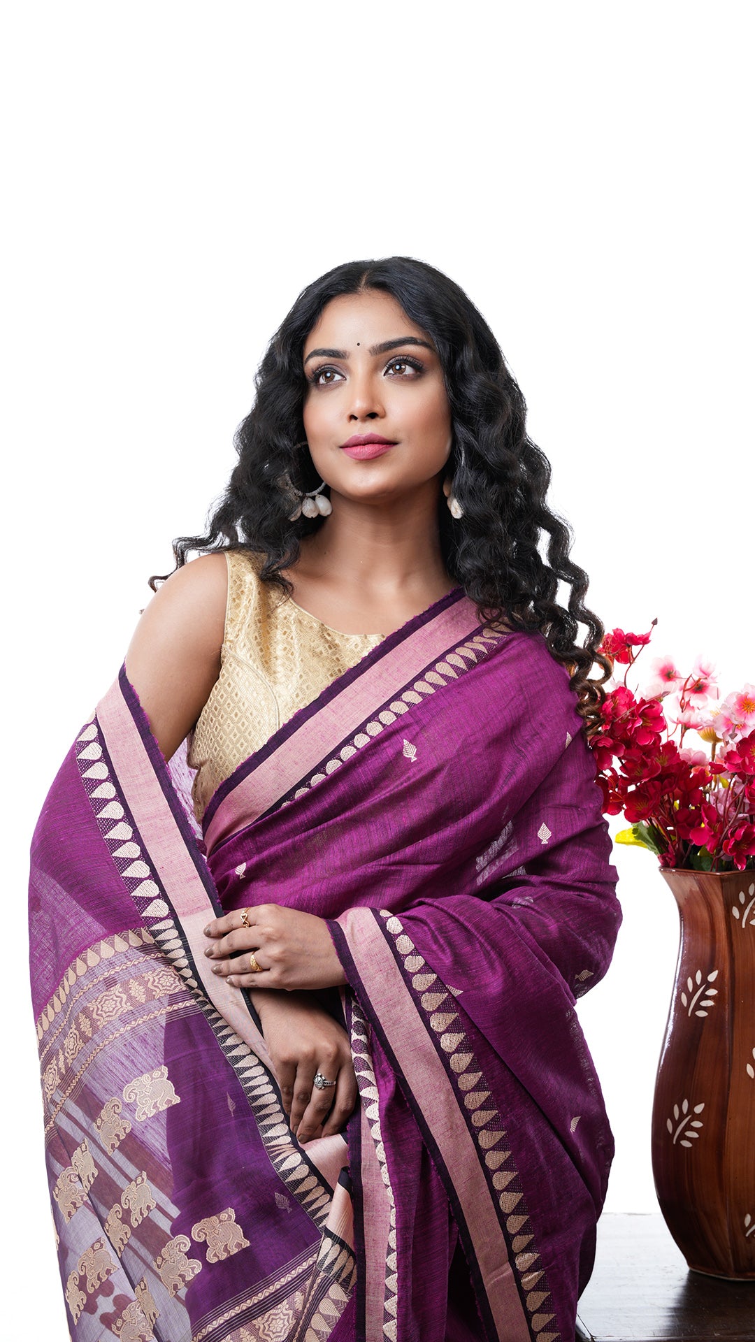 A purple raw silk saree
