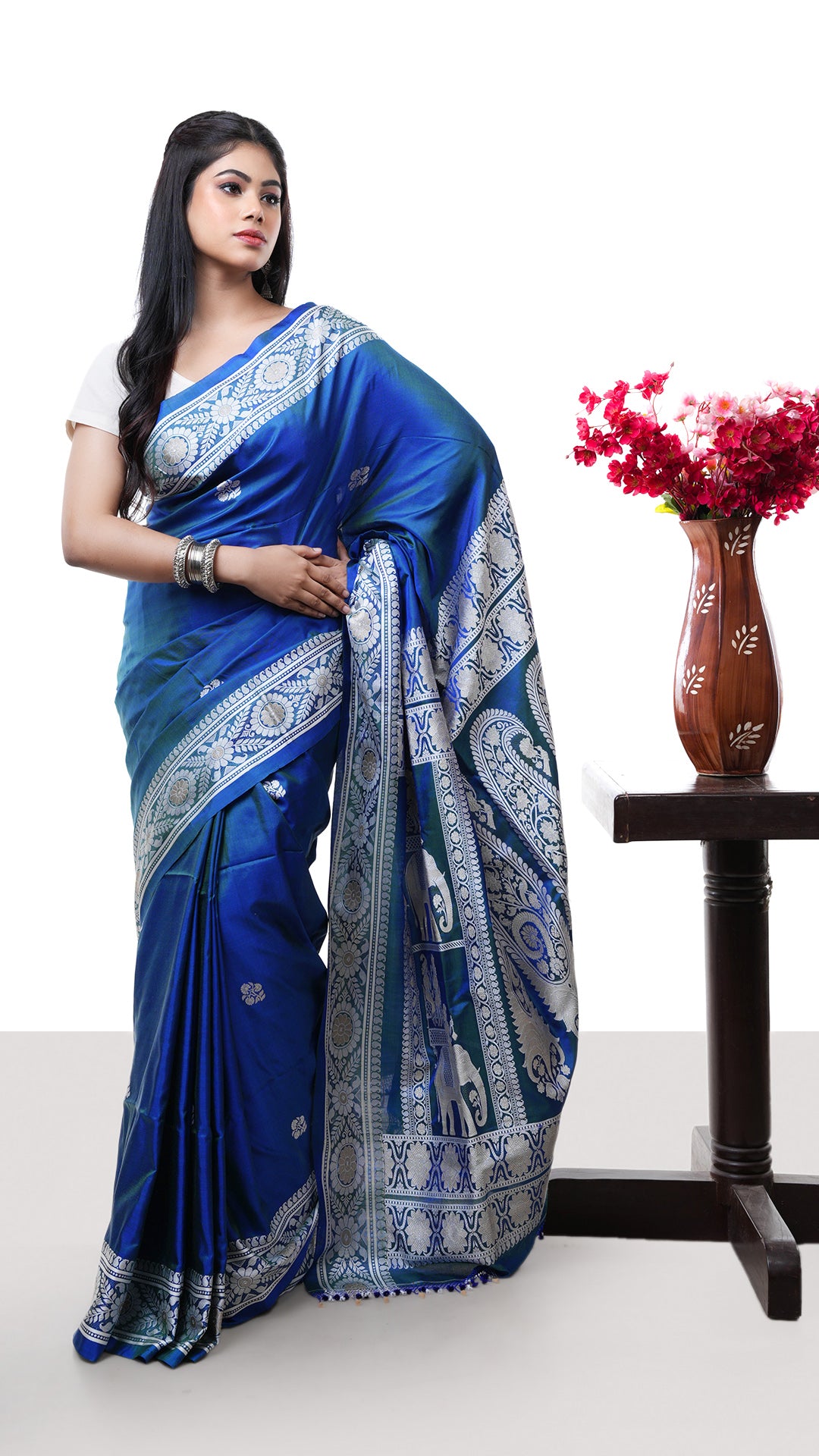 A silk saree in blue colour. A pure silk saree with royal tone. Crafted with silk Warp and weft. Standard 5.5-meter length. Includes matching blouse piece. handloom silk sari