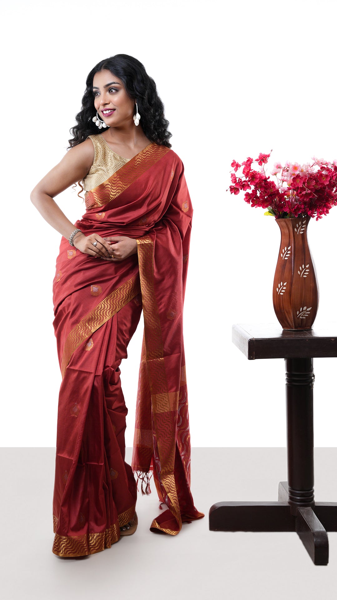 A silk saree in rust colour