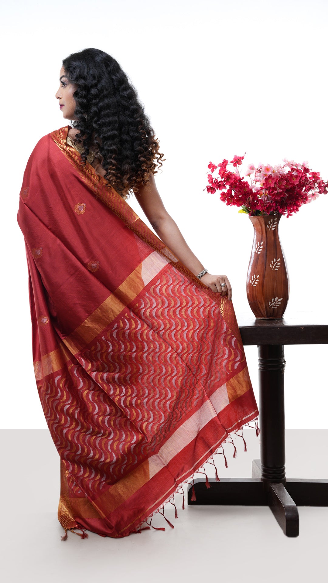 A silk saree in rust colour