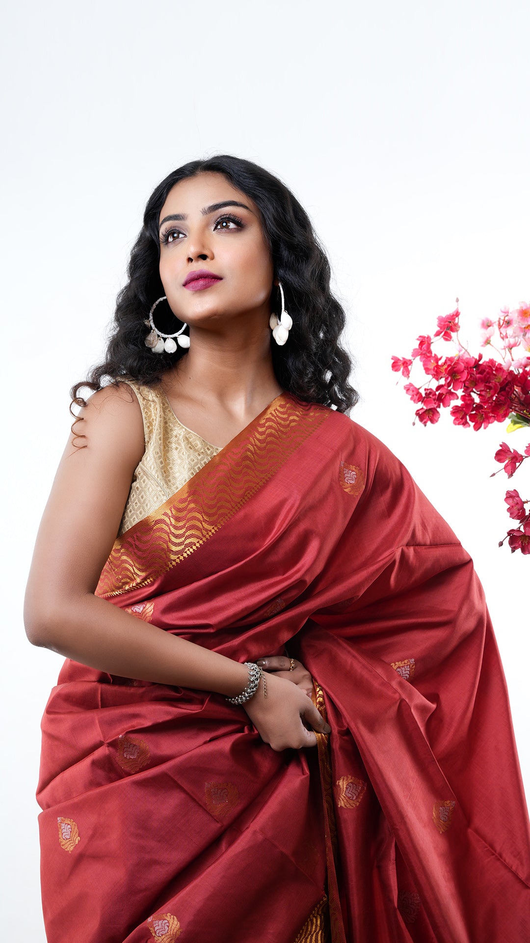 A silk saree in rust colour