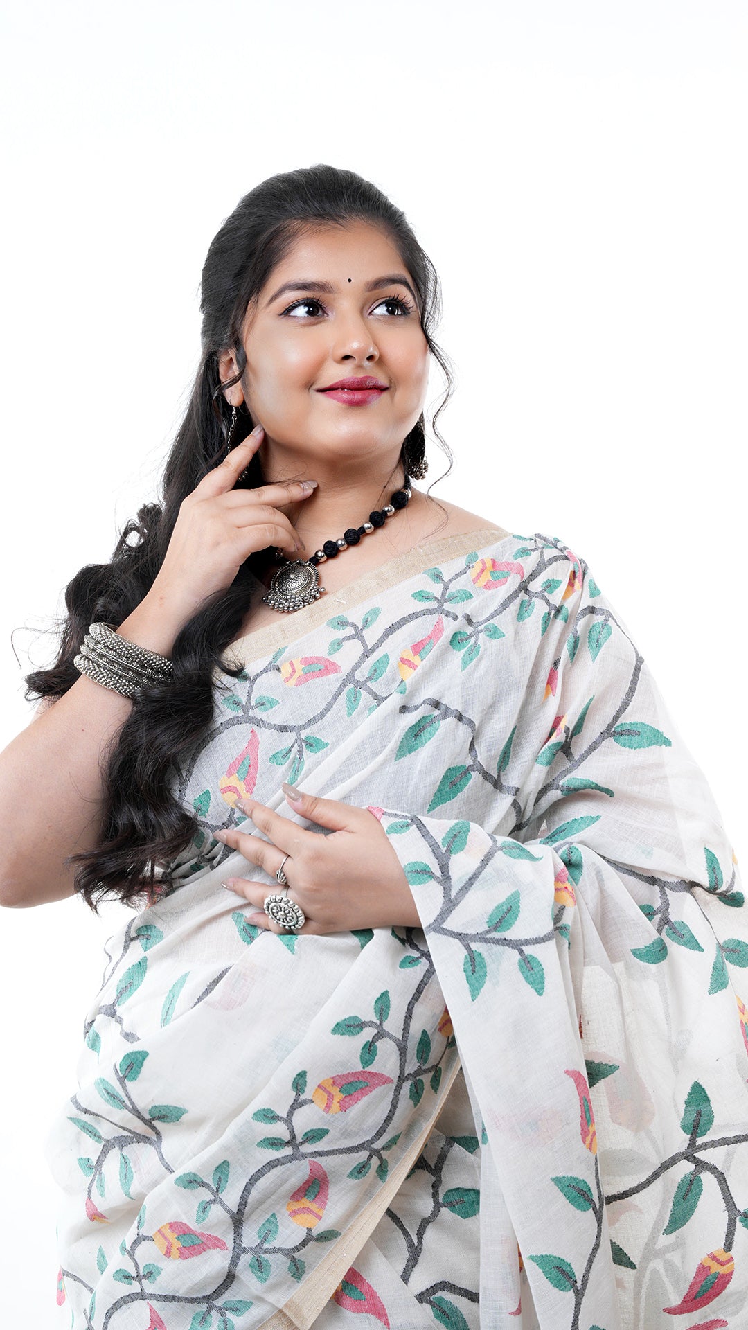 A multi coloured off white saree
