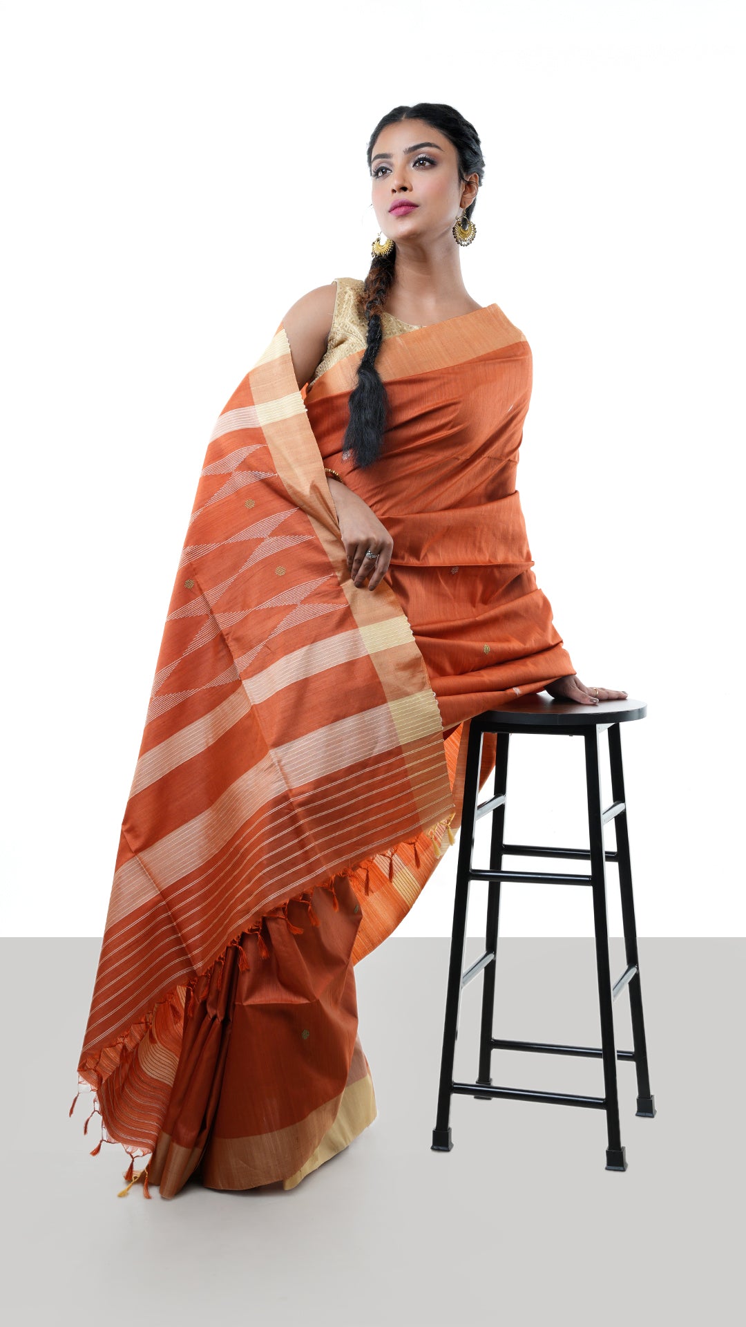 A tassar saree in rust colour