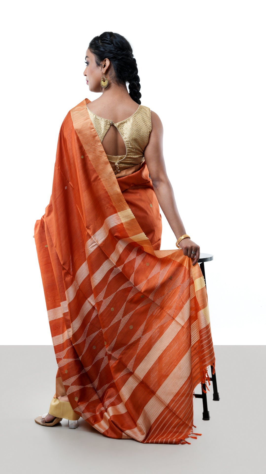 A tassar saree in rust colour