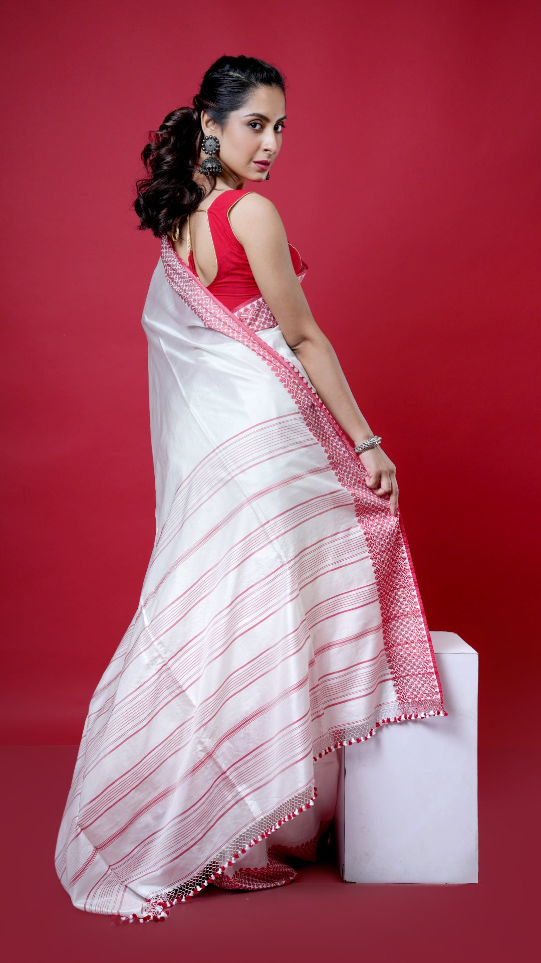 An off white with red silk saree