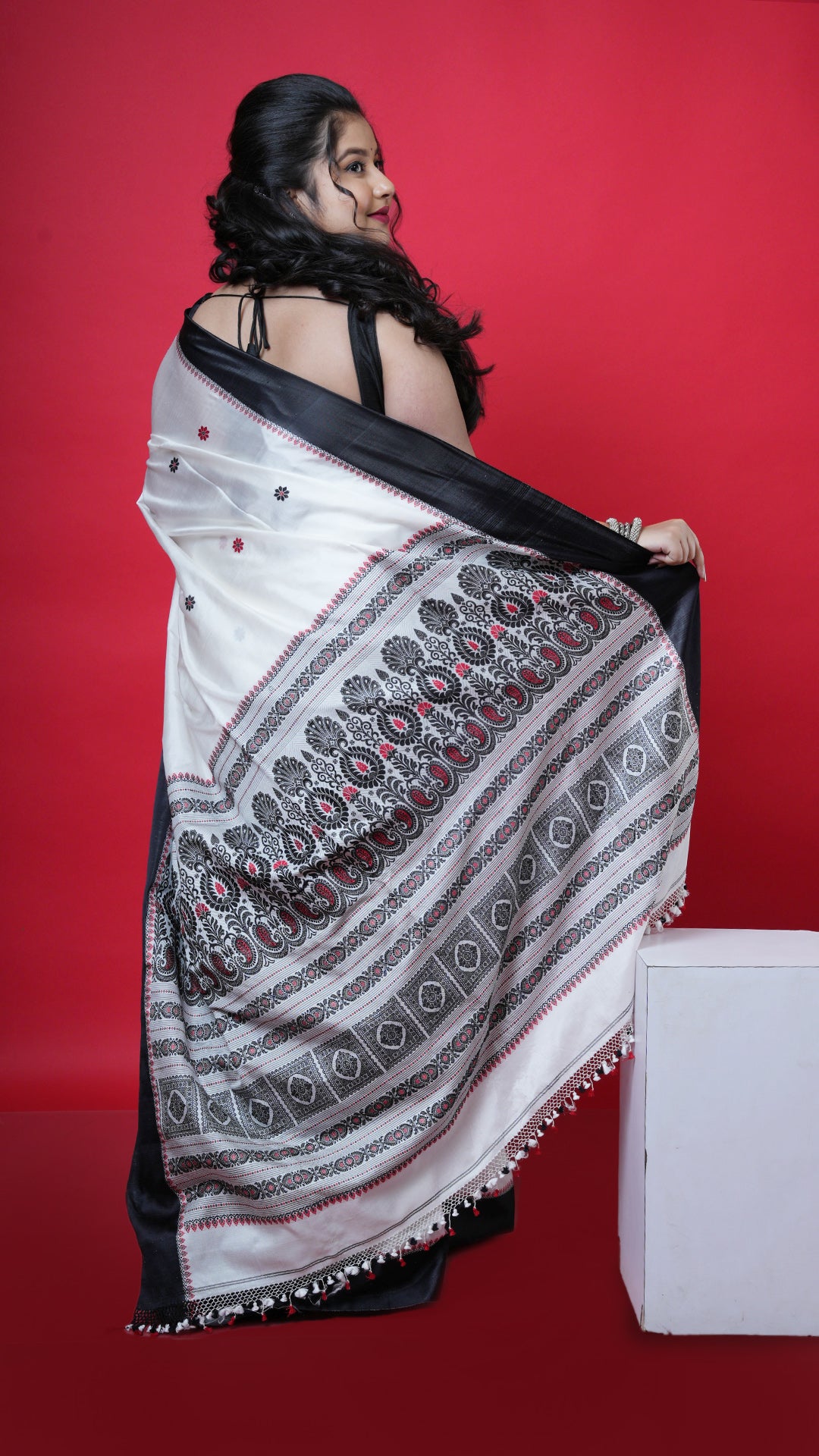 An off white with black and red silk