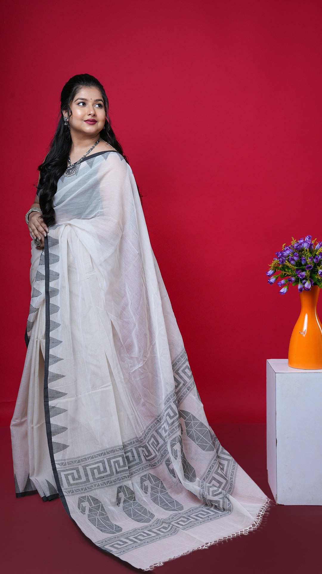 An off white and black dhakai saree. A dhakai cotton saree with off white body and black border. Crafted with cotton Warp and weft. Standard 5.5-meter length. Includes matching blouse piece. cotton saree