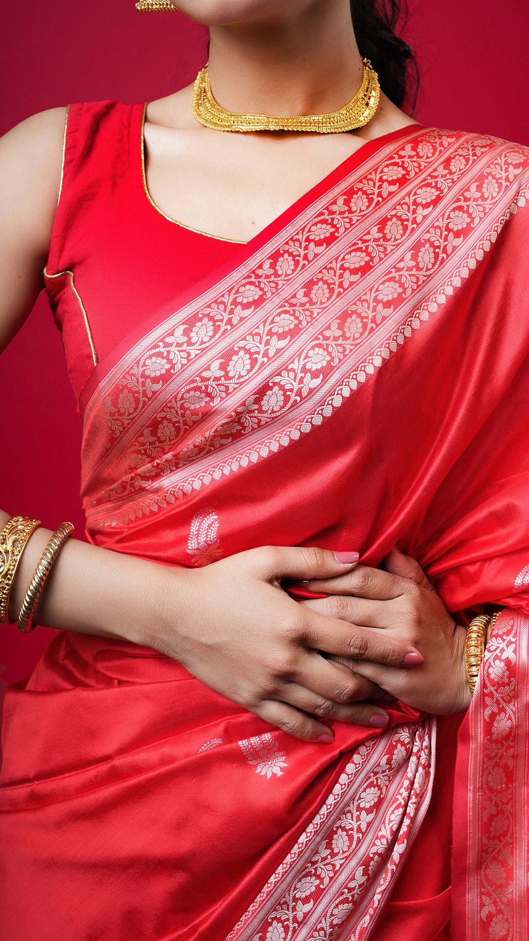 A red coloured silk saree
