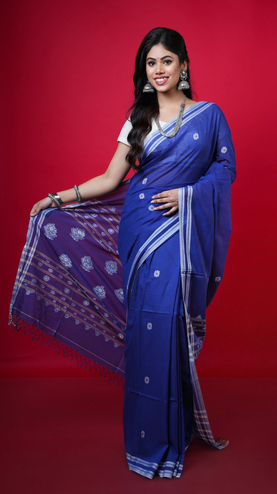 A royal blue soft cotton saree. A soft cotton sari in rich royal blue tone. Crafted with soft cotton Warp and weft. Standard 5.5-meter length. Includes matching blouse piece. cotton saree