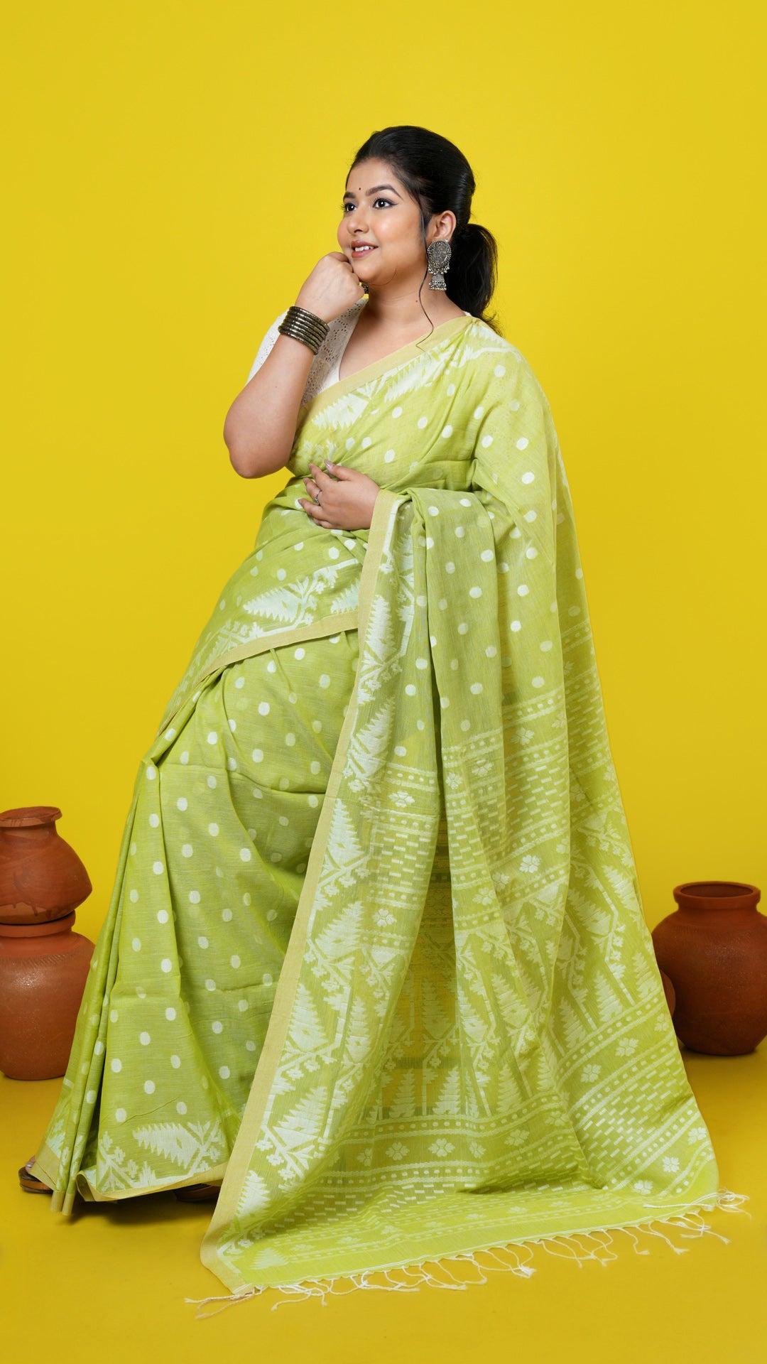 A green coloured saree, made of Soft cotton Warp and Soft cotton weft. Perfect for traditional, office, regular, gifts, this saree includes has blouse piece, 0.80 mts, running. Price: Rs. 2600/-. Category: Tant, dhakai.