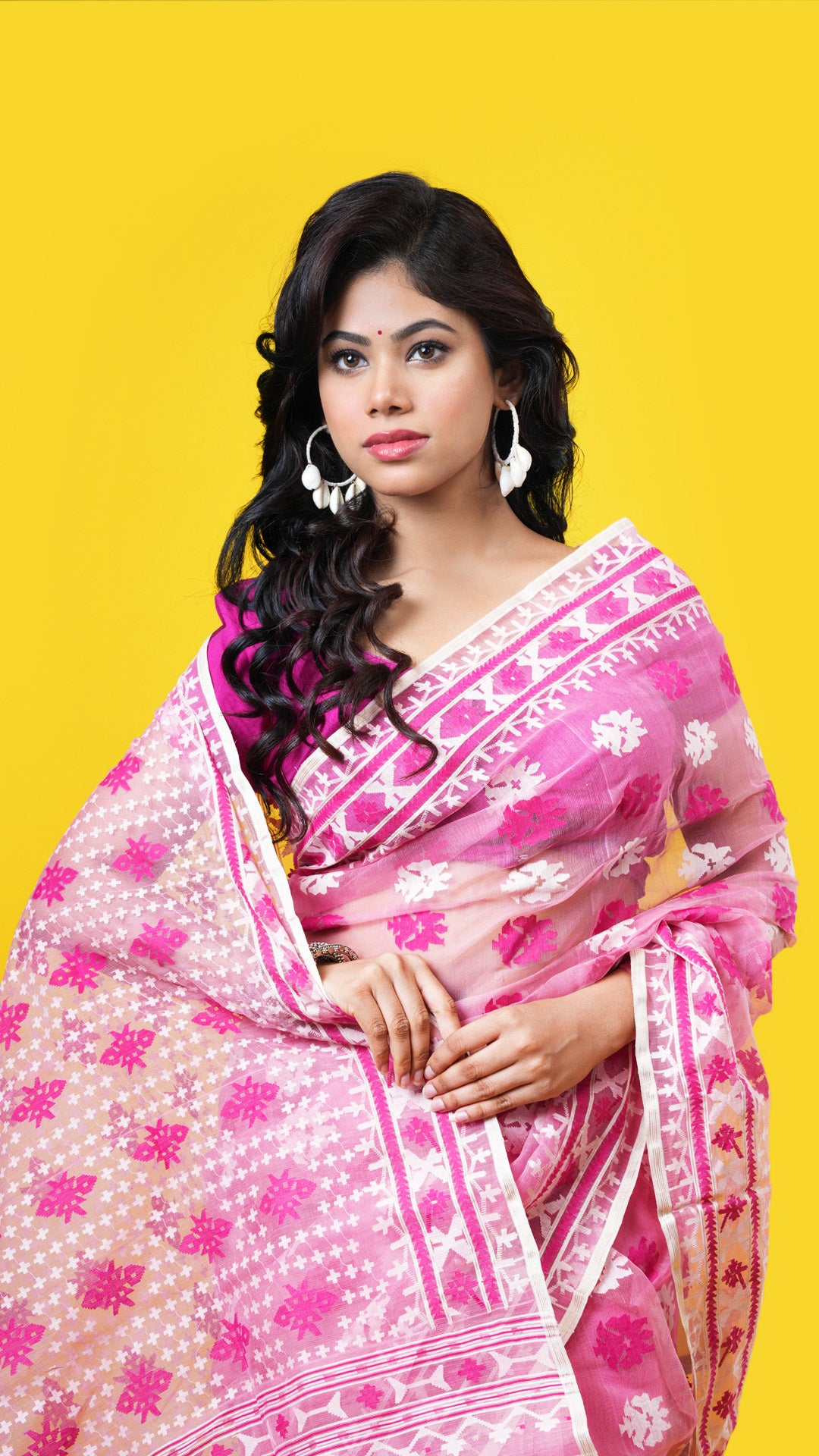 A light pink jamdani saree