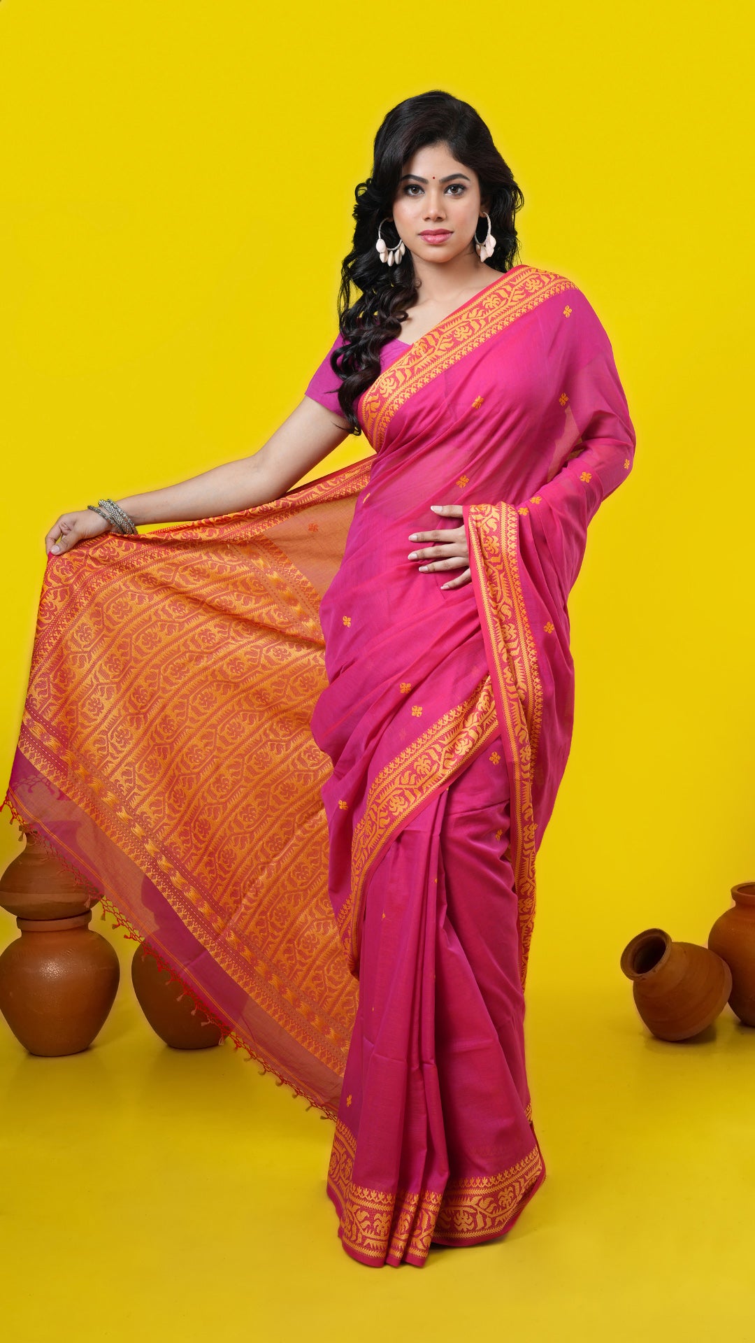 A pinkish red dual tone tangail saree, made of Soft cotton Warp and Soft cotton weft. Perfect for traditional, party wear, wedding, gifts, this saree includes has blouse piece, 0.80 mts, running. Price: Rs. 3000/-. Category: Tangail, tant, jaquard.