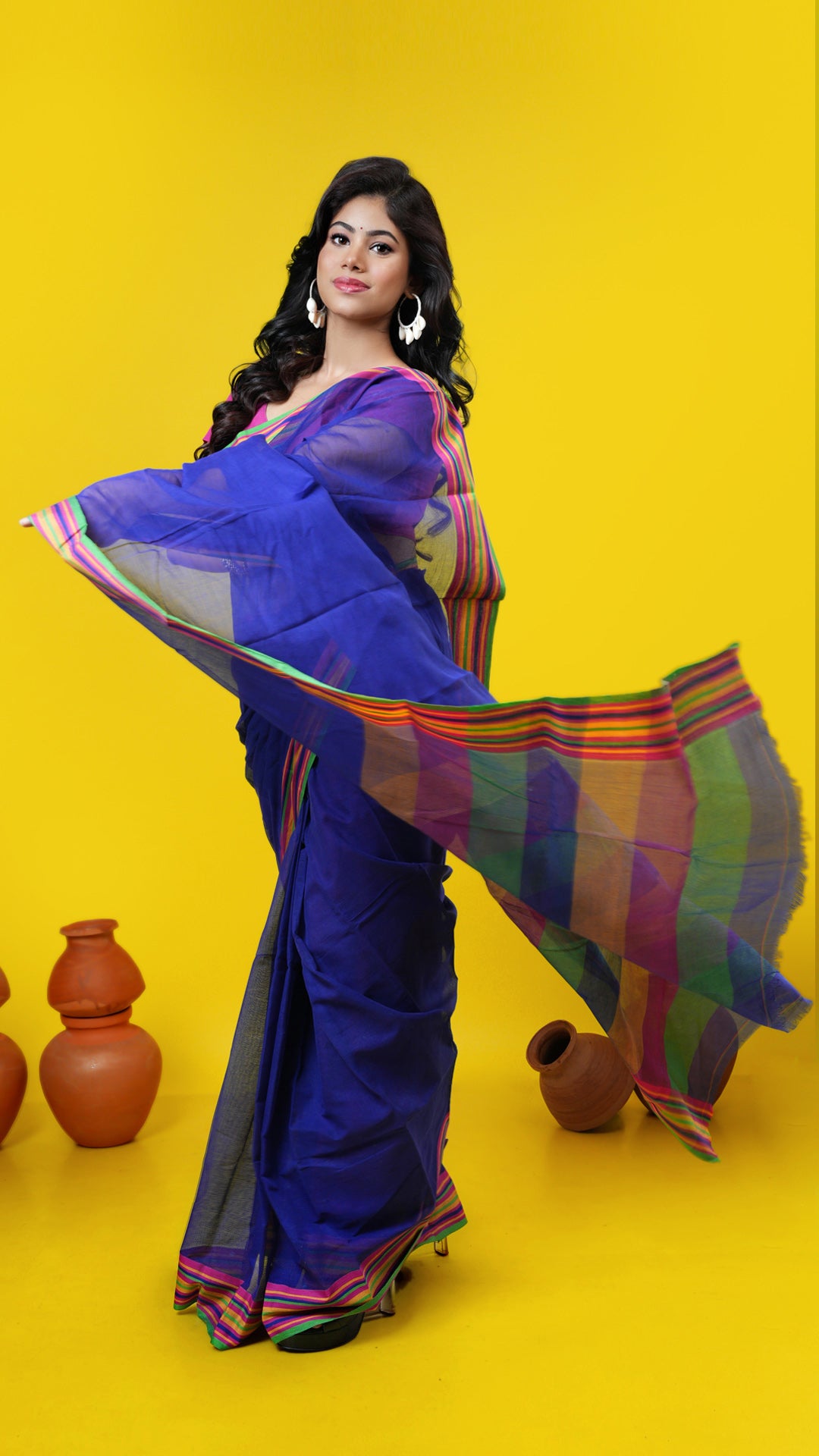 A blue coloured cotton saree, made of Cotton Warp and Cotton weft. Perfect for traditional, office, regular, gifts, this saree includes no blouse piece. Price: Rs. 1000/-. Category: Tangail, tant, jaquard.