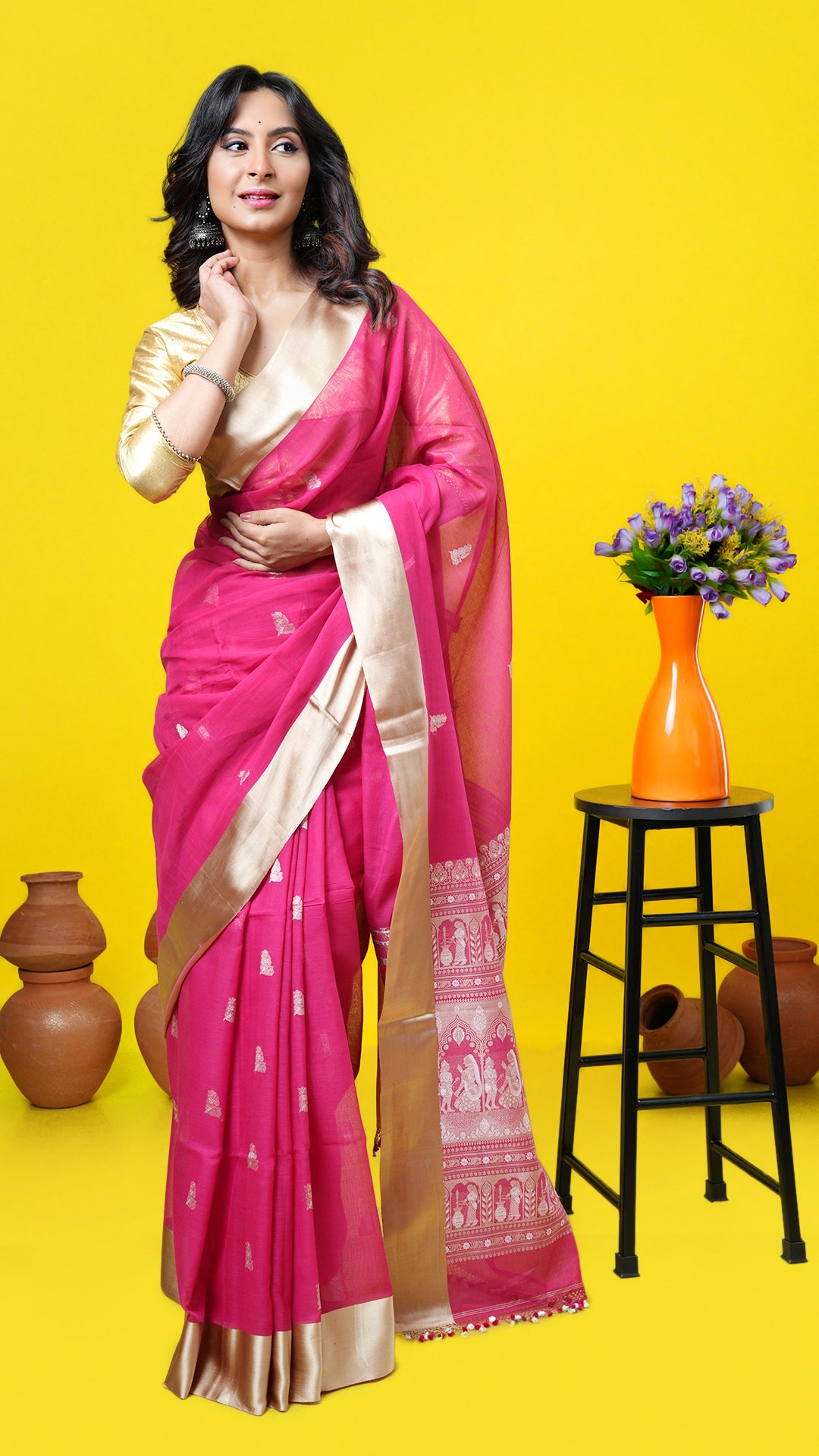 A pink coloured baluchari design saree