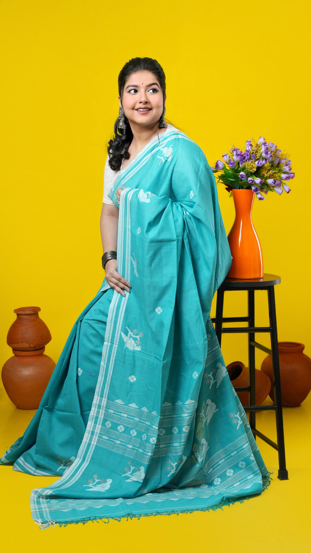 Sea green soft cotton Tangail saree with bird motifs and butis in off-white and beige. Price: Rs. 3,650/-