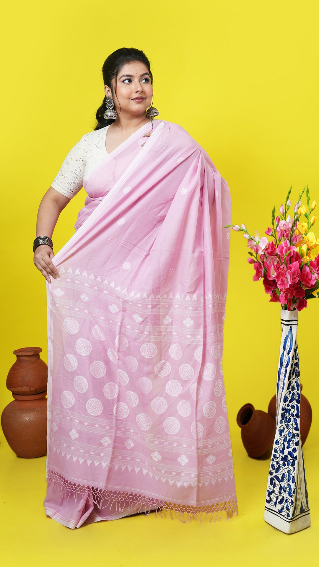 A light pink tangail saree
