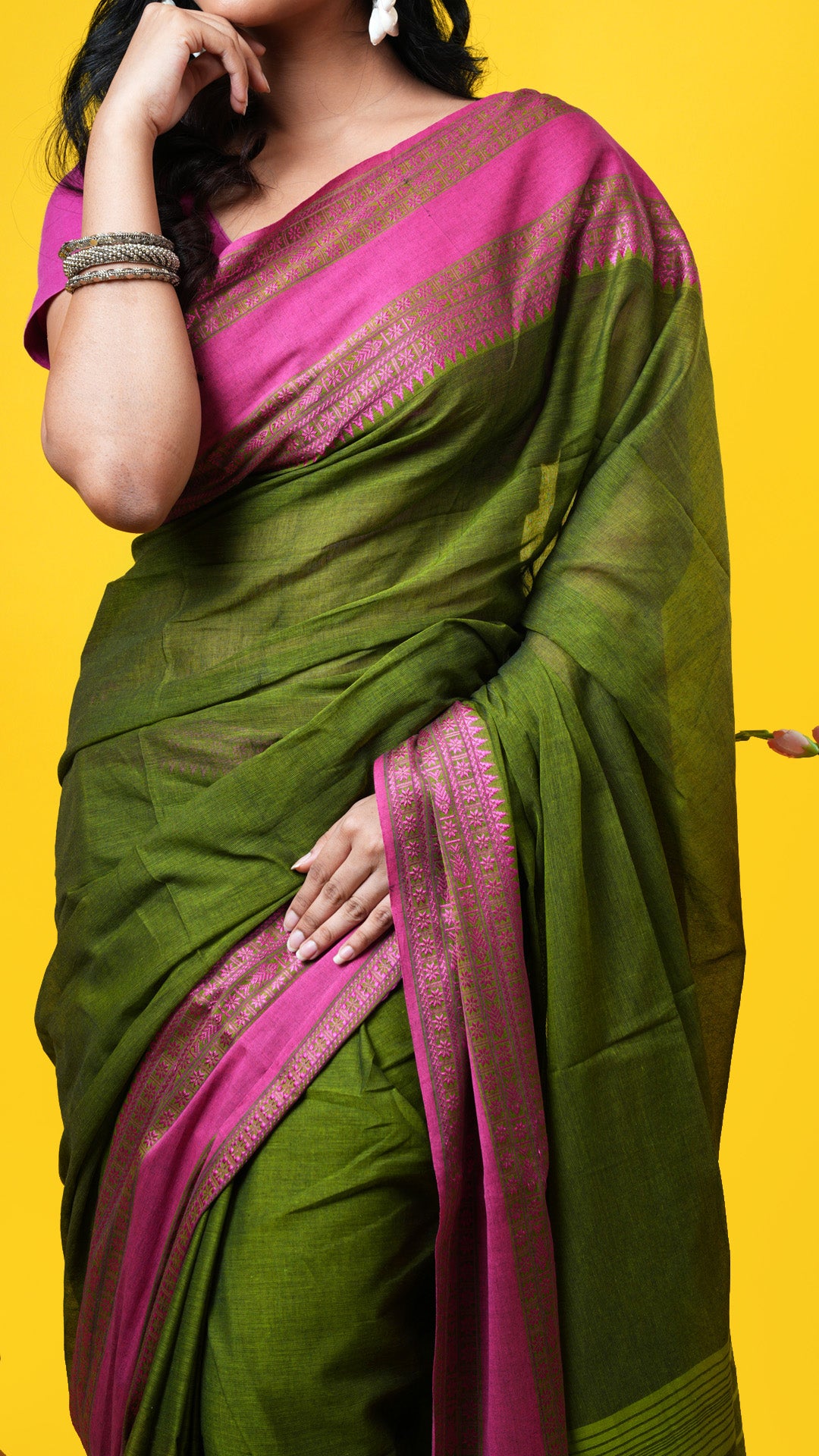 A dark green tangail saree