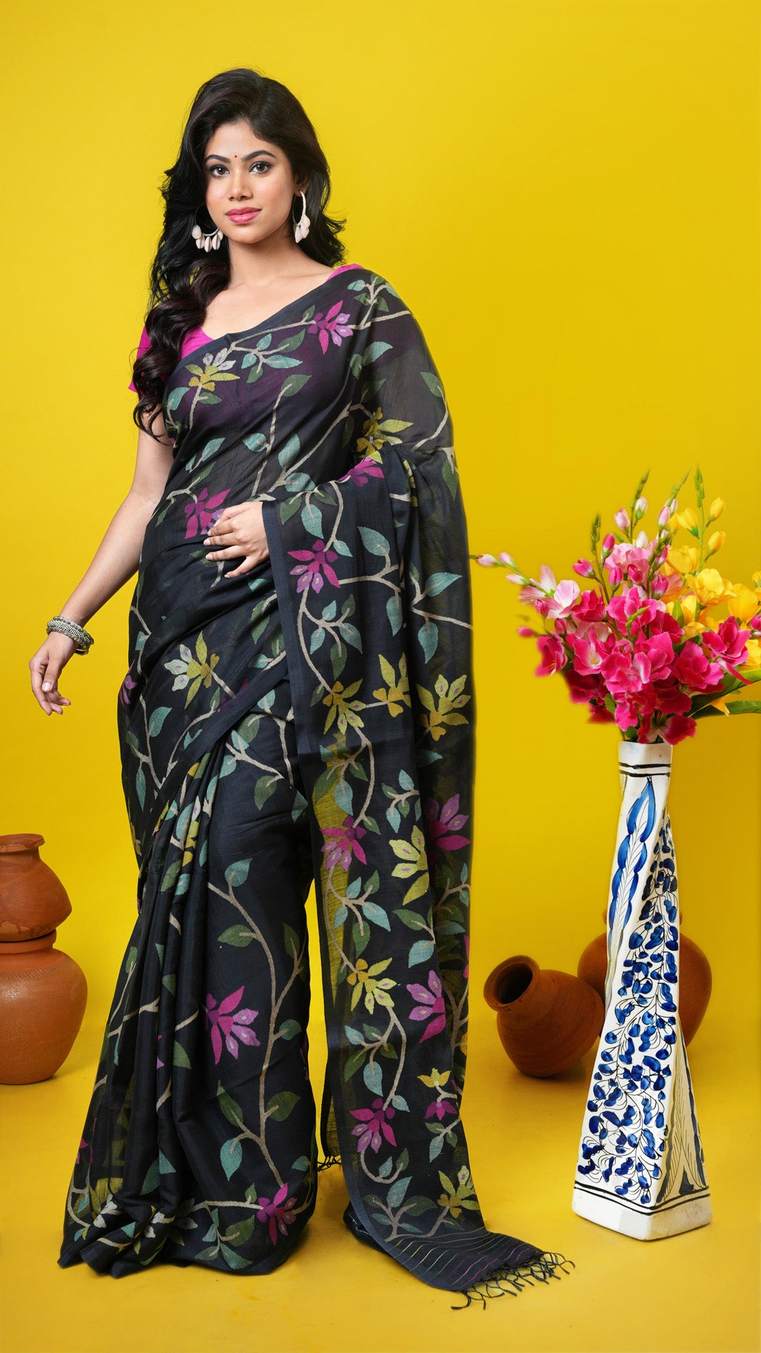 Black soft cotton Dhakai saree with multicolor floral weave in beige, green, pink, magenta, and yellow. Price: Rs. 40,000/-